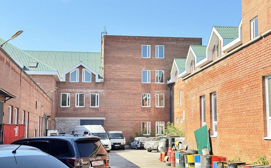 Многопрофильное здание и земельный участок, 6 000 м² фото