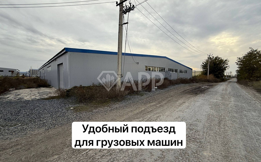 Склад с удобным подъездом рядом с городом 1 400м2 фото